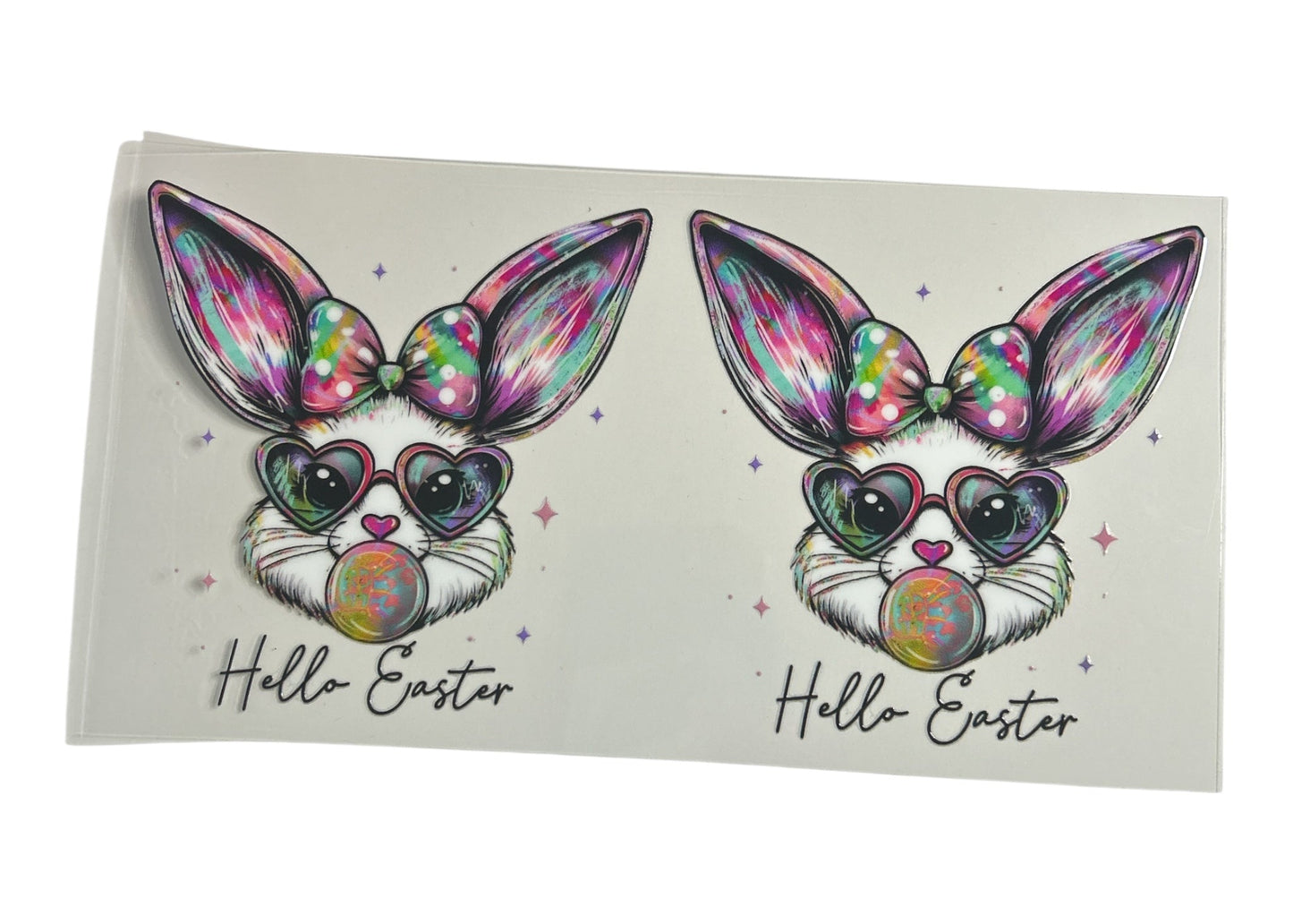 Two colorful Easter bunny designs with rainbow hearts and 'Hello Easter' text on a white background.