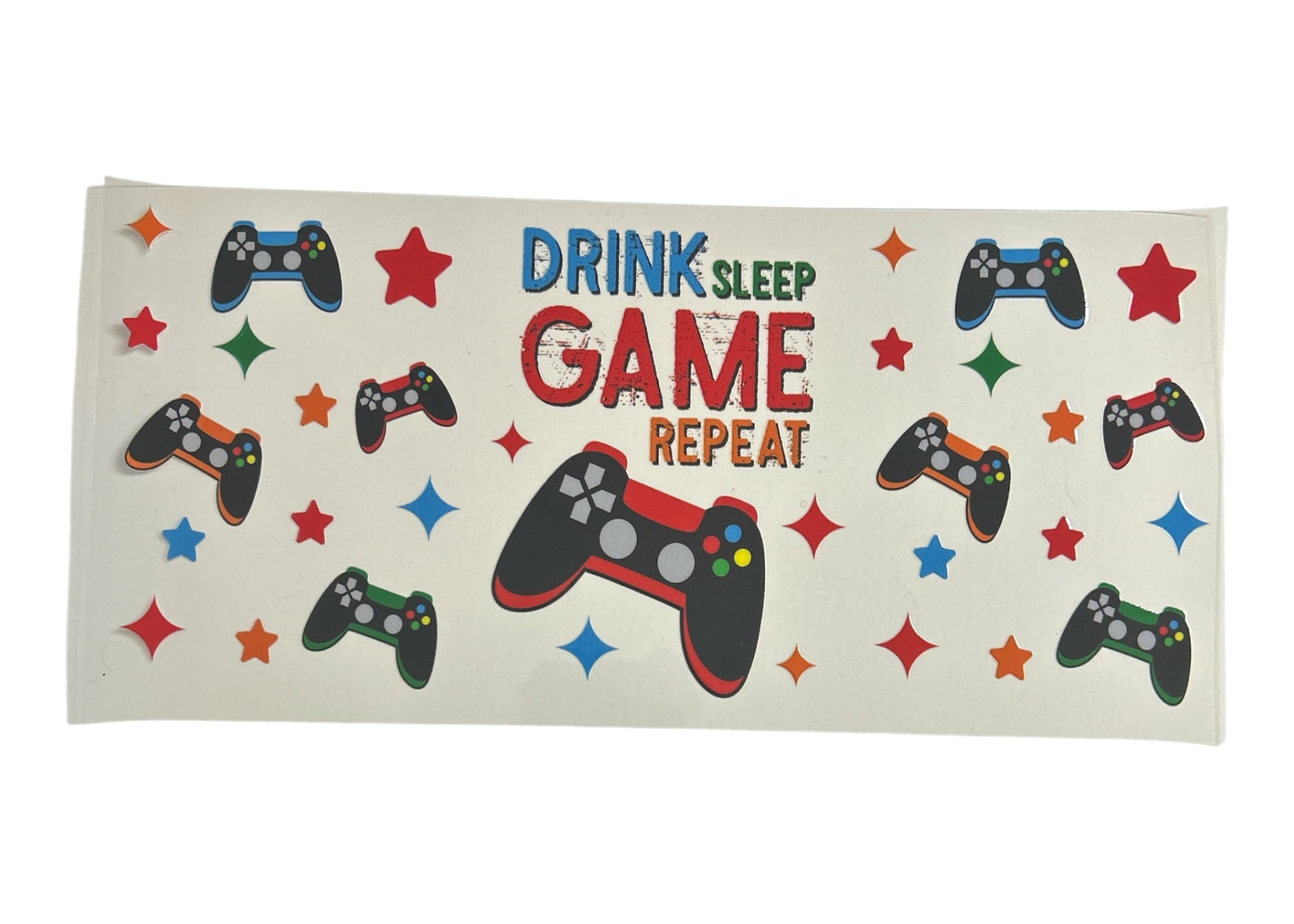 Cup wrap with gaming controller designs and text 'Drink Sleep Game Repeat' on a white background
