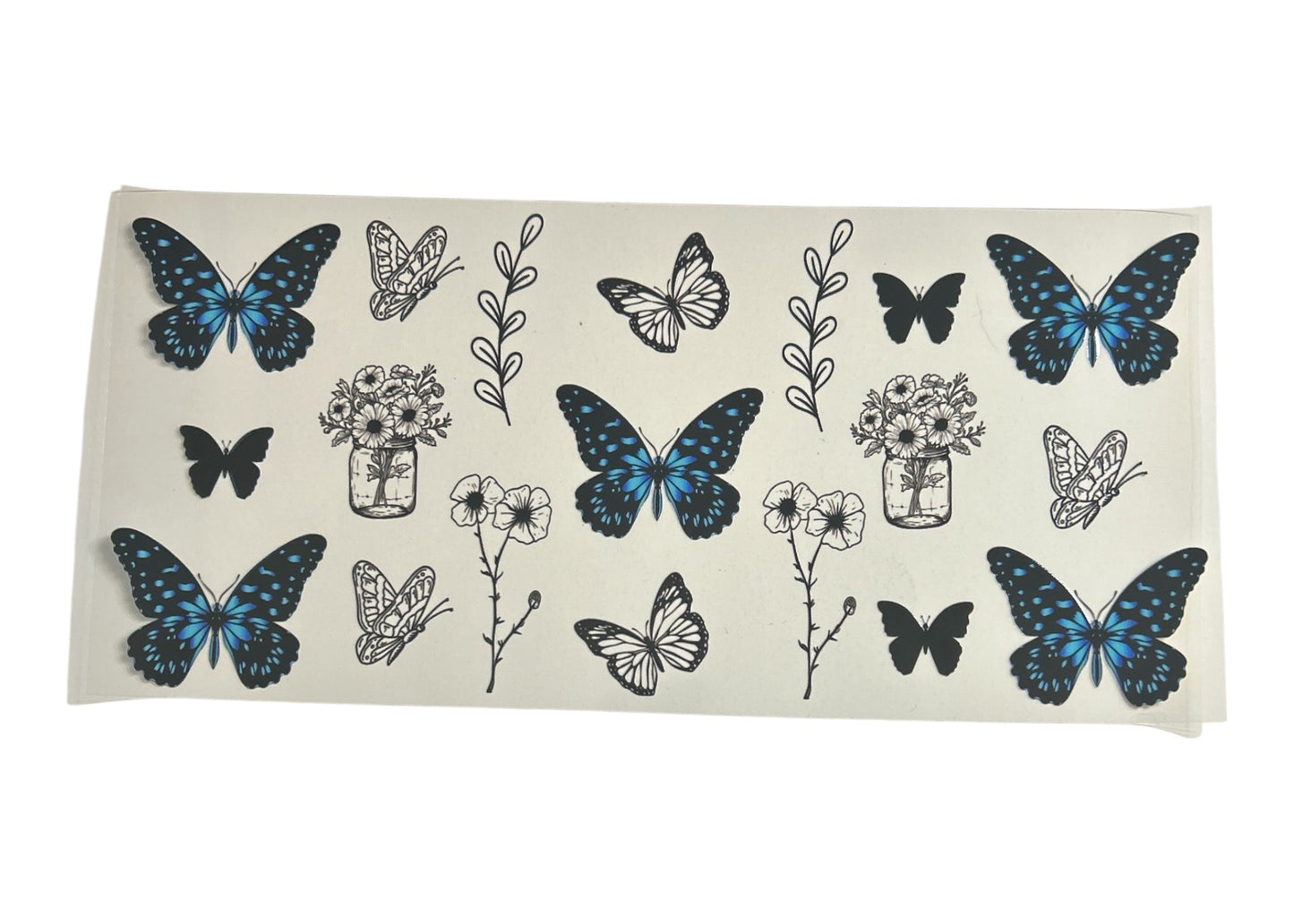 Cup wrap with blue butterflies and floral designs on a clear background