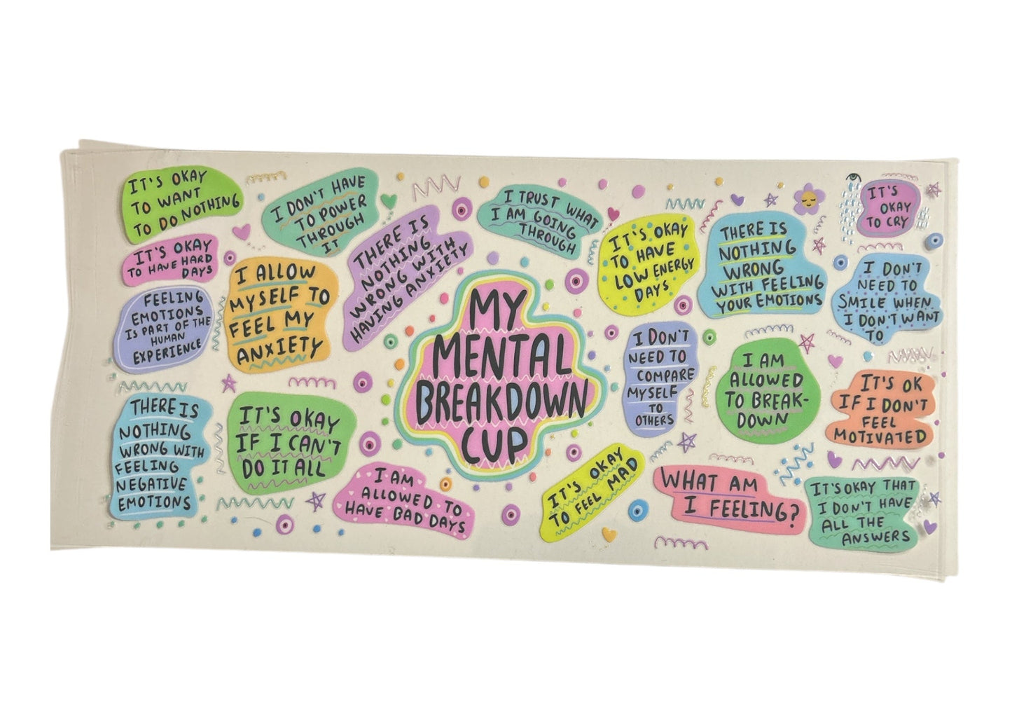 Colorful cup wrap with motivational phrases on a clear background