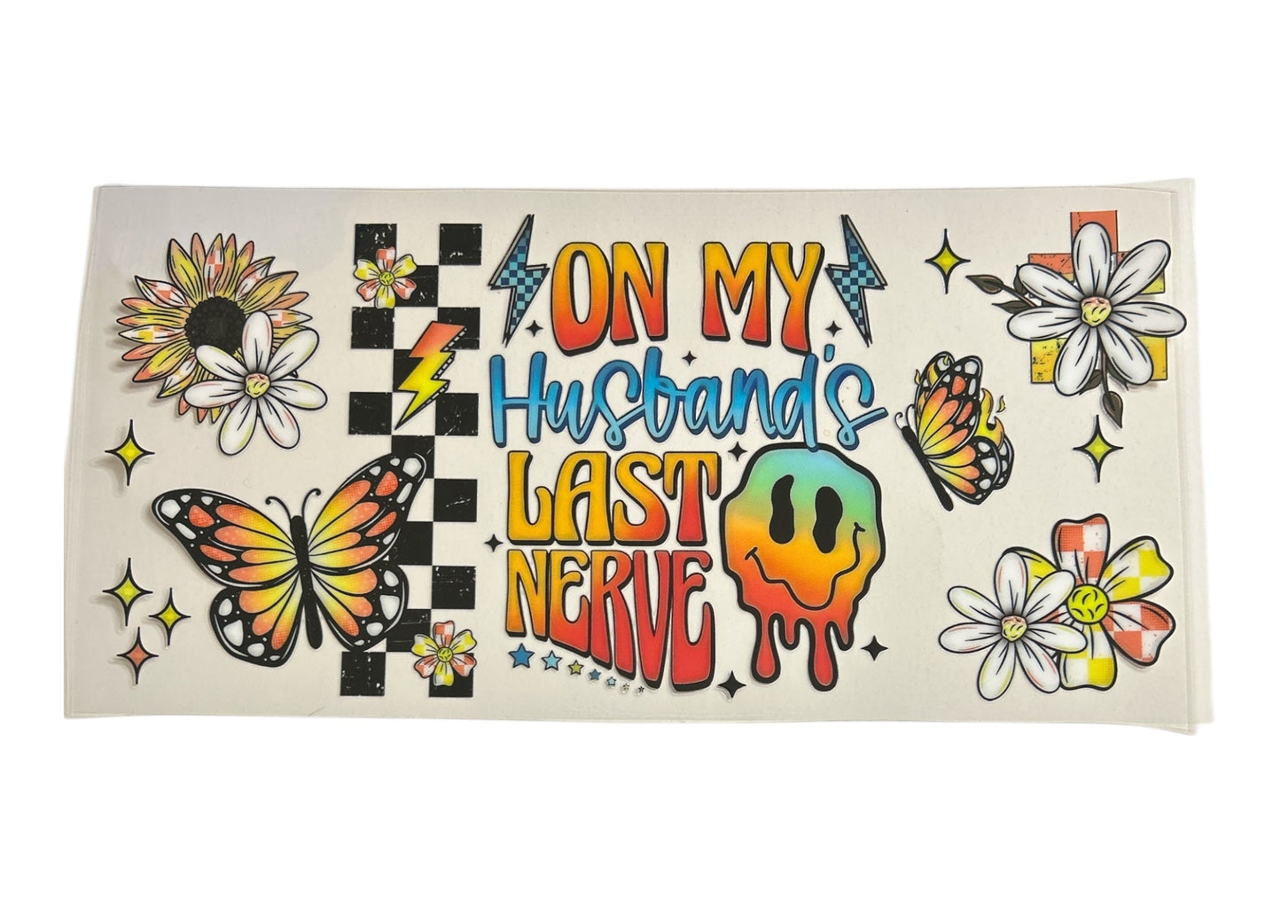 Colorful cup wrap with decorative elements and 'on my husband's last nerve' text on a clear background
