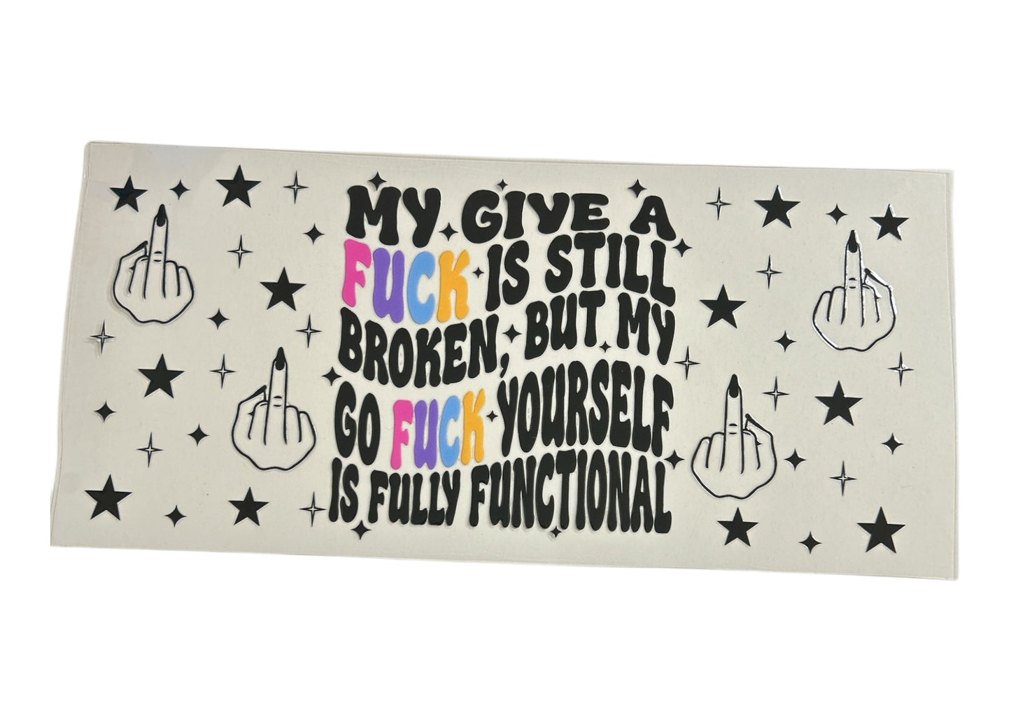 Edgy cup wrap design with bold retro text reading "My give a fuck is still broken, but my go fuck yourself is fully functional" surrounded by black middle finger hand icons and stars.
