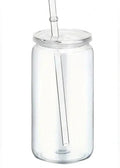 Clear acrylic tumbler with a straw on a white background