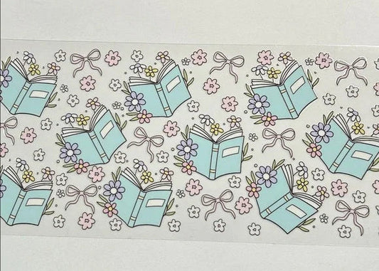 Pattern of books, flowers, and ribbons on a light background
