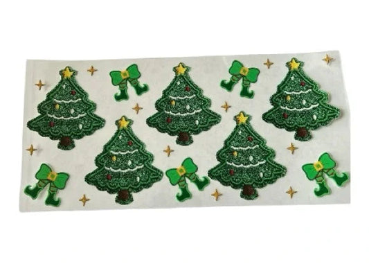 Sheet of green Christmas tree stickers with decorative elements on a clear background