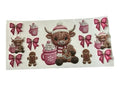 Embroidered-look cup wrap with a Highland cow, hot chocolate, gingerbread men, and pink bows on a clear background.