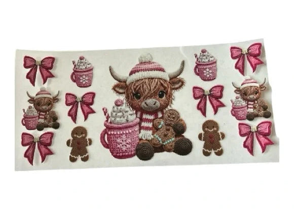 Embroidered-look cup wrap with a Highland cow, hot chocolate, gingerbread men, and pink bows on a clear background.