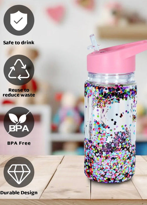 Colorful water bottle with a pink lid on a wooden surface, featuring icons indicating safety and sustainability.