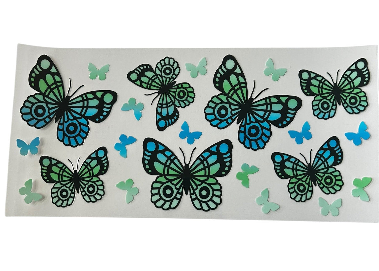 Blue green butterfly pattern cup wrap with teal and blue butterflies in multiple sizes