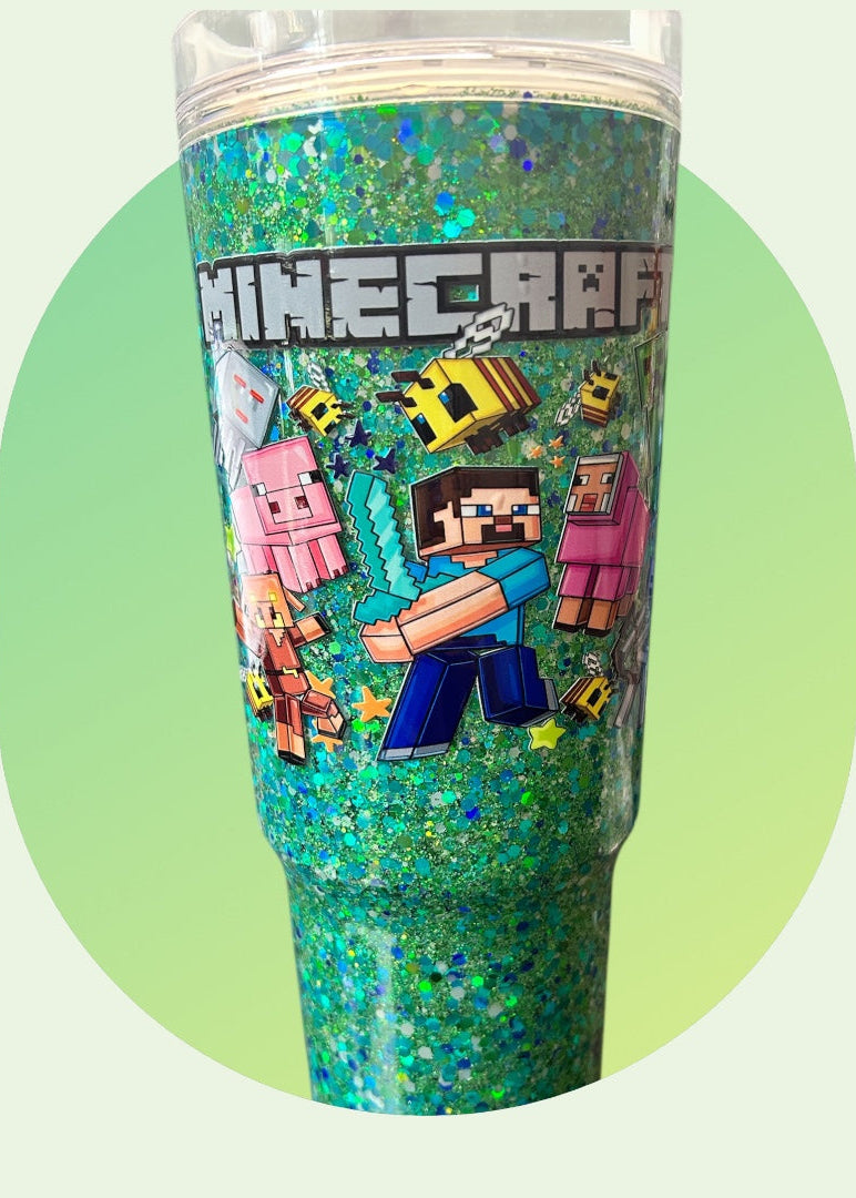 Glittery tumbler with Minecraft characters on a light green background