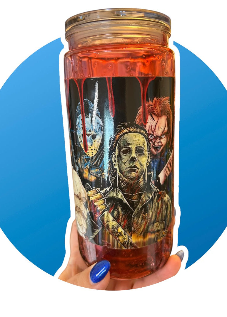 Tumbler with horror-themed design held by a hand against a blue circle background