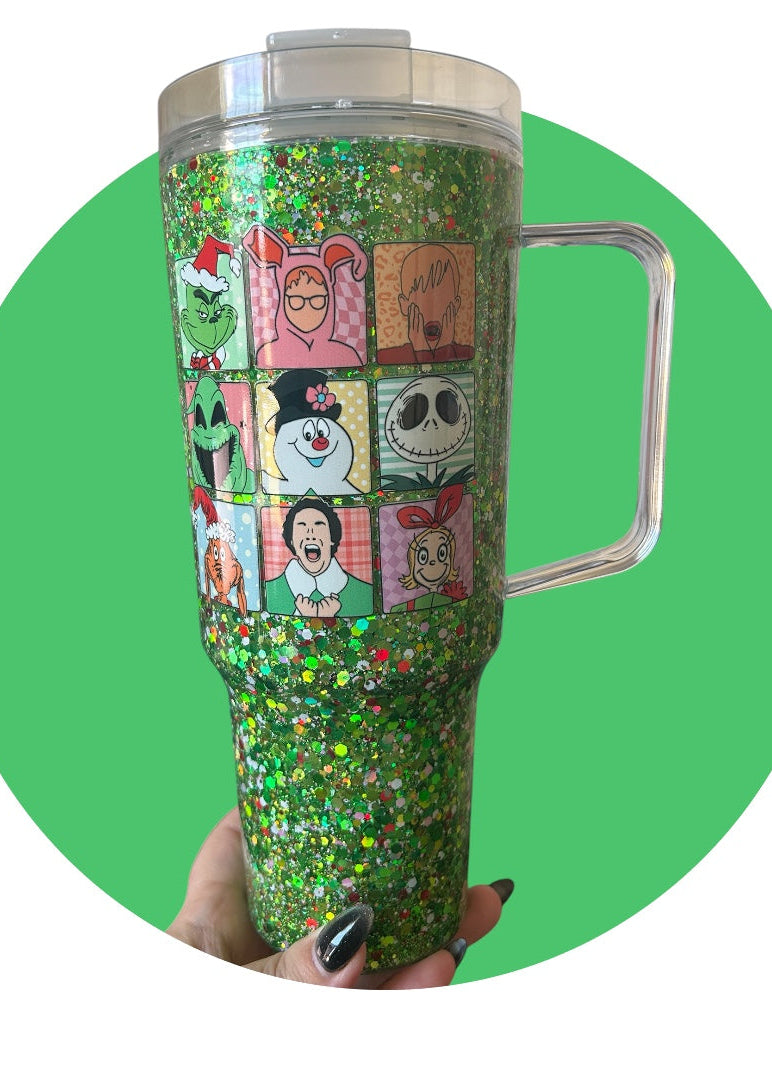 Tumbler with cartoon character design on a green background