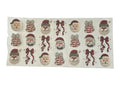 Sheet of decorative stickers featuring Santa Claus and bows on a clear background