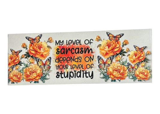 Decorative cup wrap with orange flowers, butterflies, and a humorous quote on a white background.