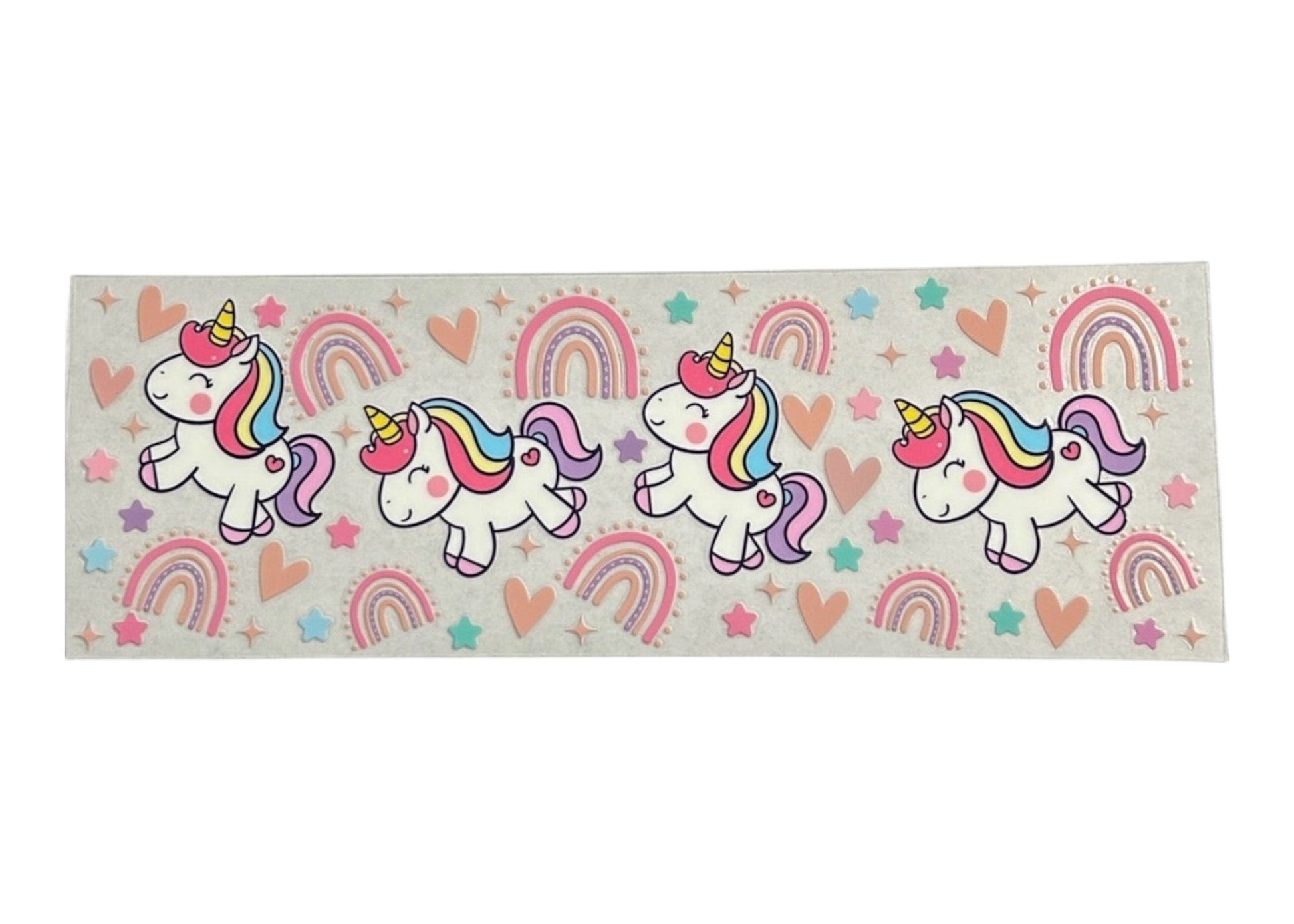 Clear cup wrap with unicorn and rainbow designs on a clear background