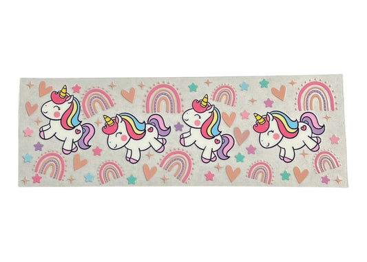 Clear cup wrap with unicorn and rainbow designs on a clear background