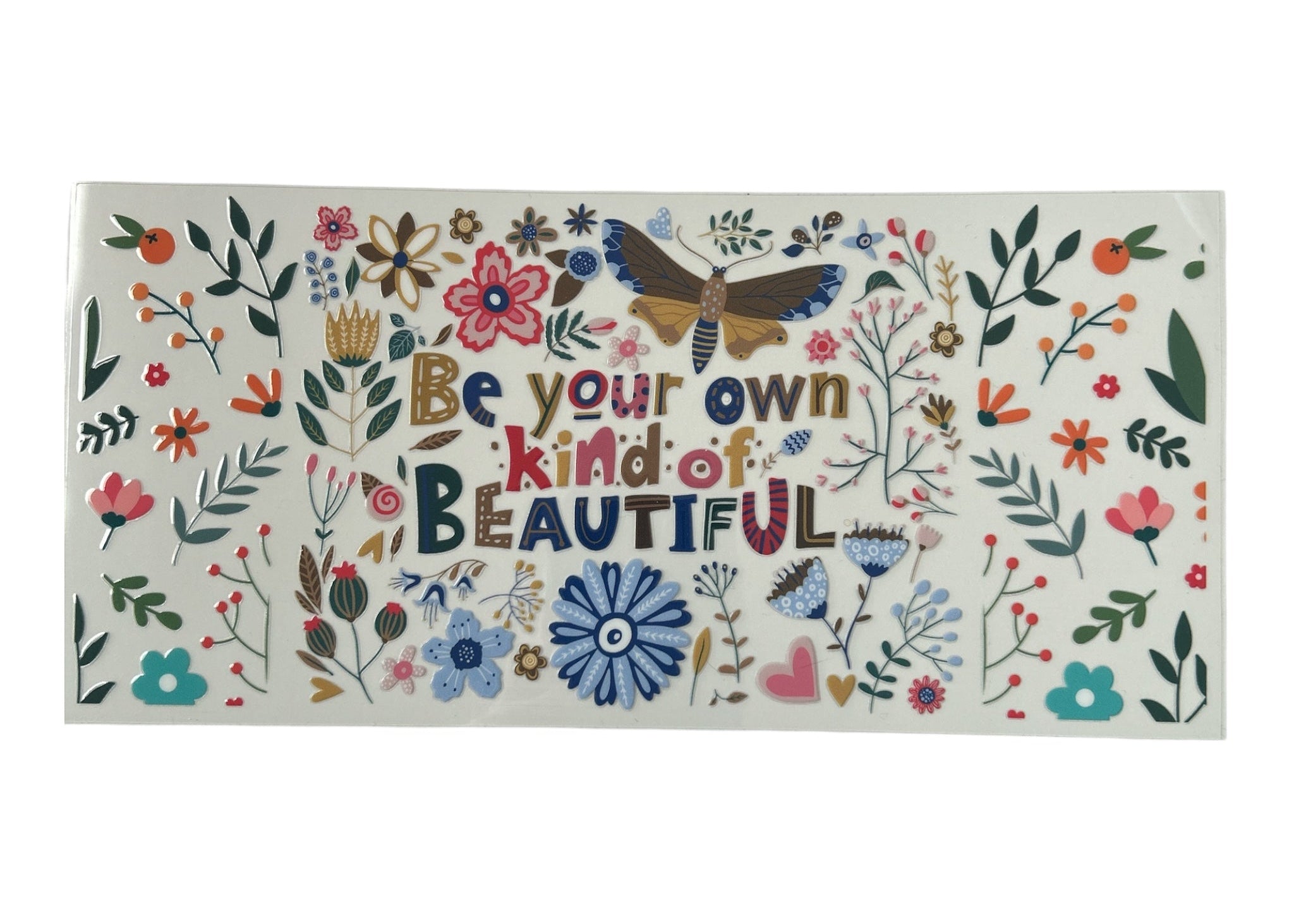 Decorative cup wrap with floral designs and motivational text on a white background