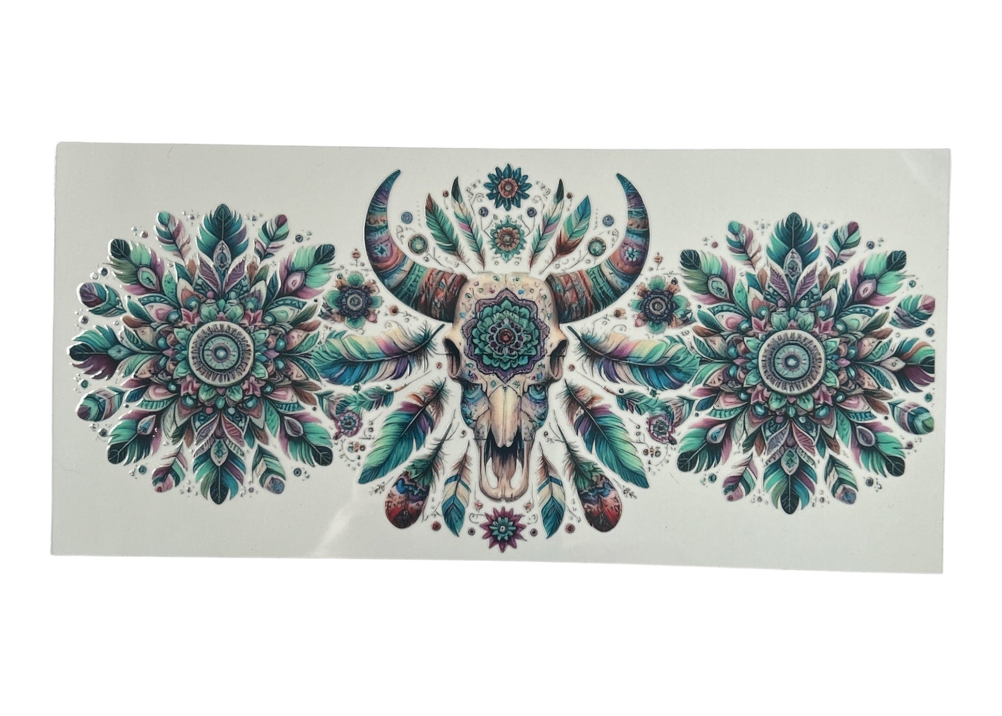 Cup wrap with a bull skull design and floral patterns on a clear background