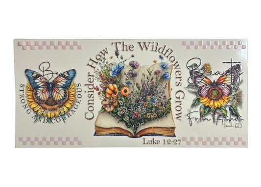 Decorative cup wrap with floral design, butterflies, and Bible verse text on a white background.