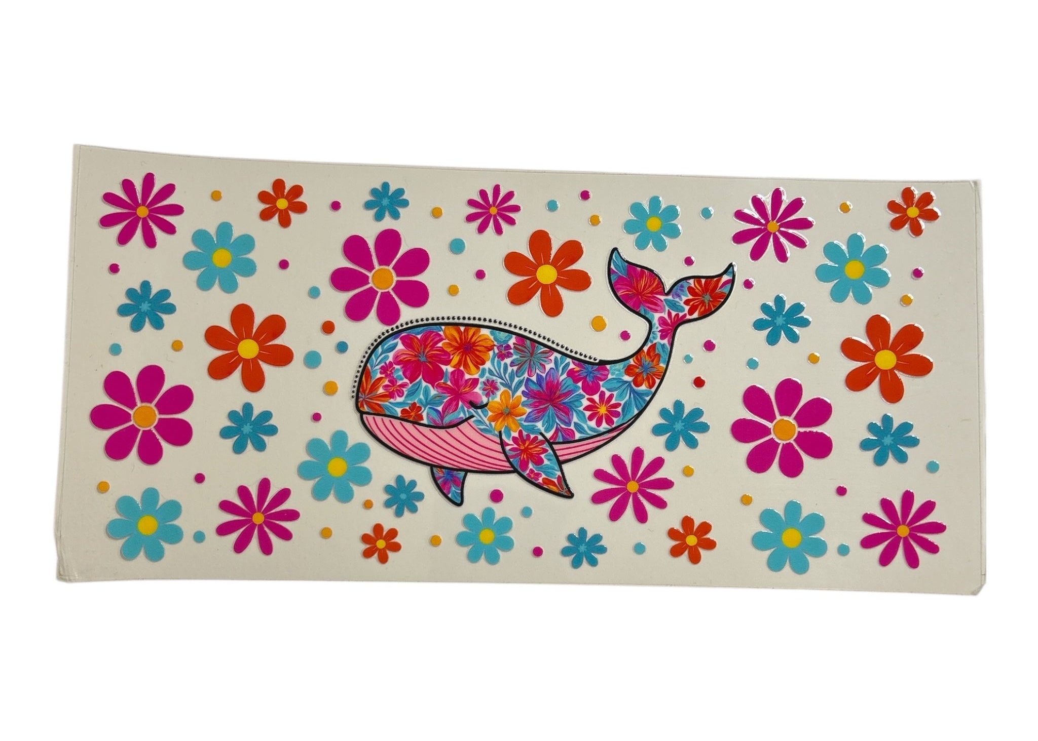 Colorful decal with a whale design and flowers on a white background