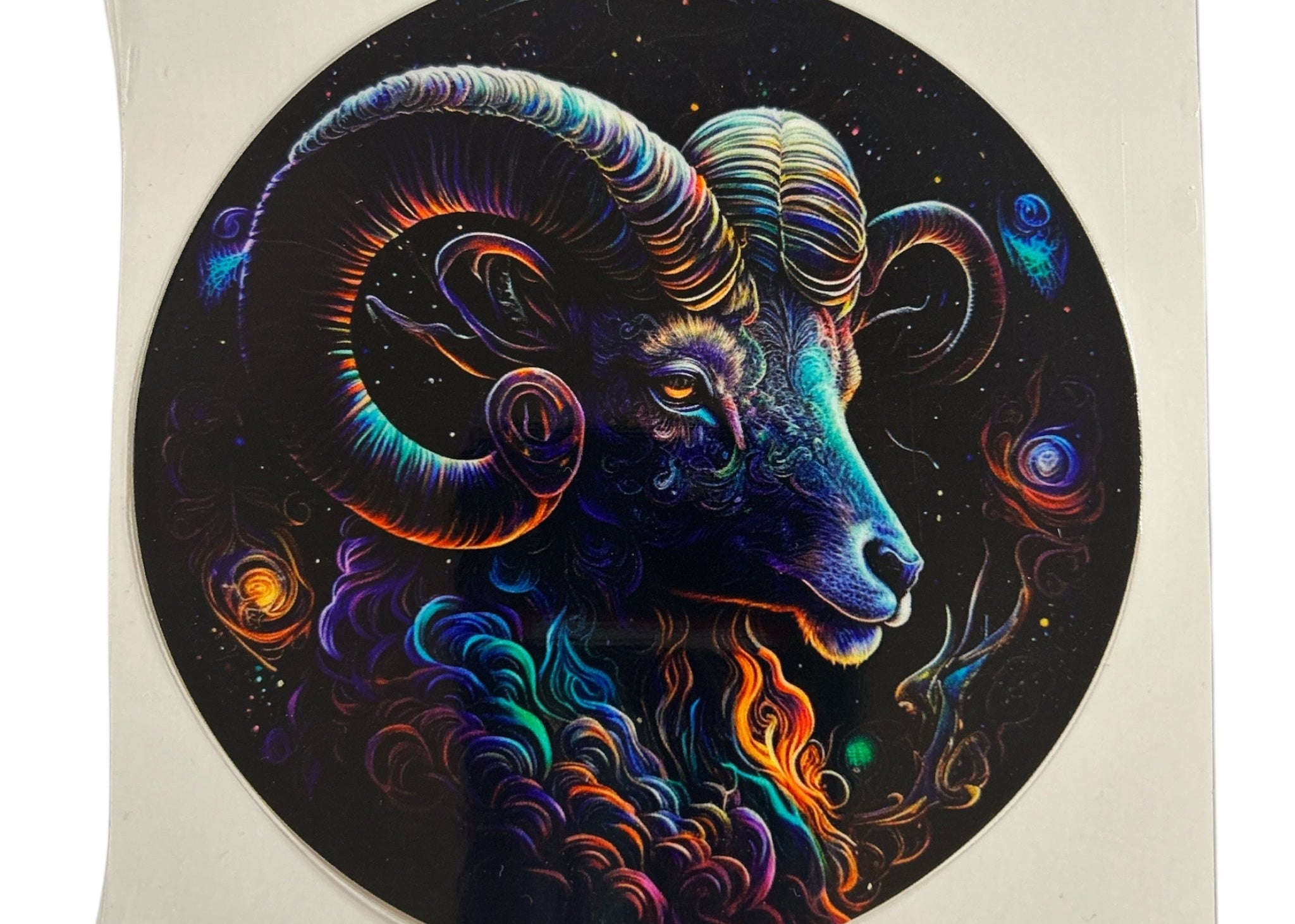 Colorful aurochs head design on a circular sticker with a starry night background.