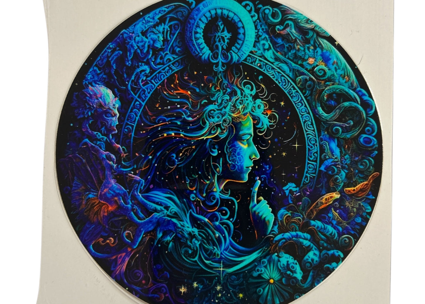 Colorful circular artwork of a stylized face with intricate Aquarius designs on a clear background