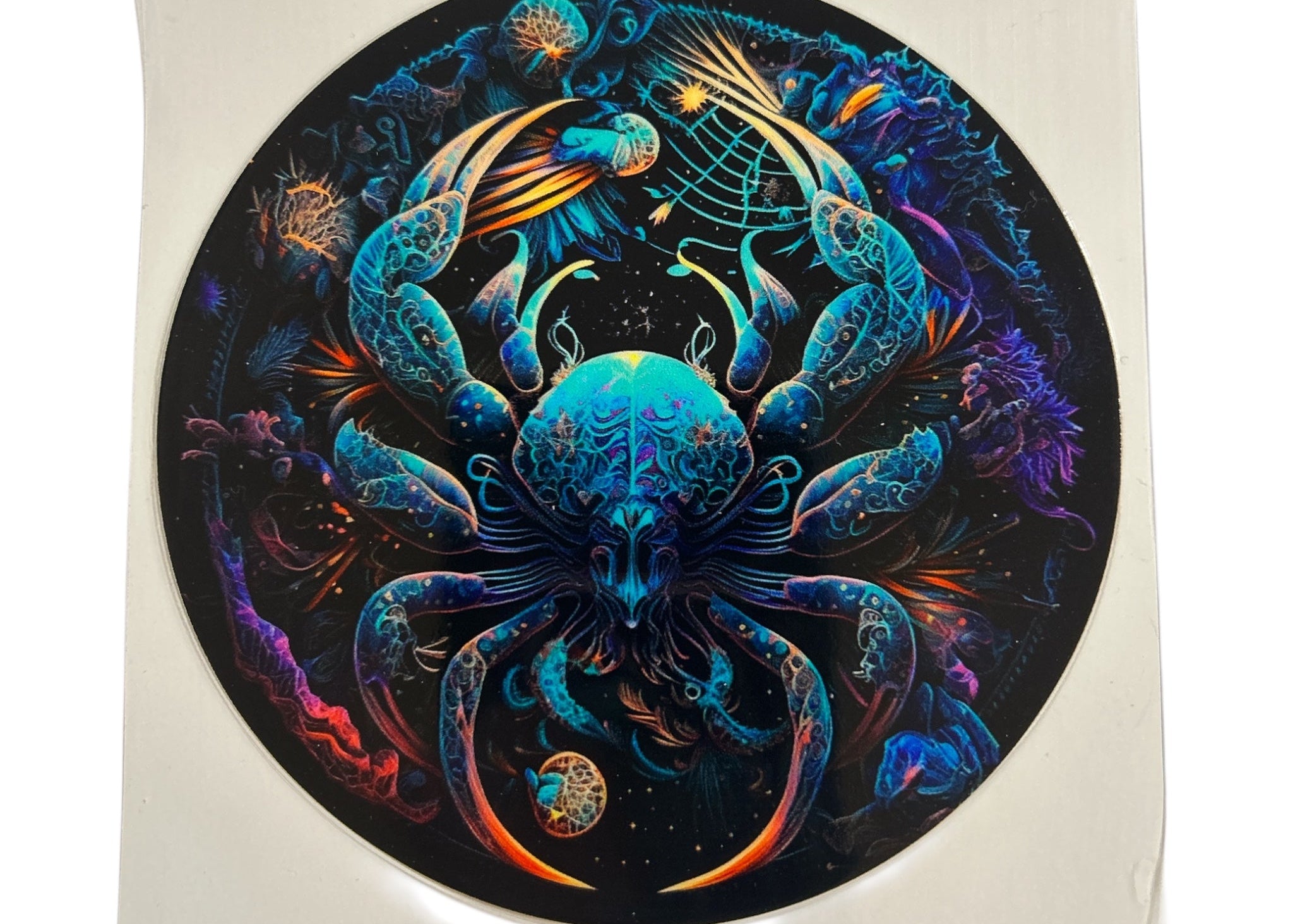 Colorful abstract Cancer Zodiac design on a circular decal with a black background