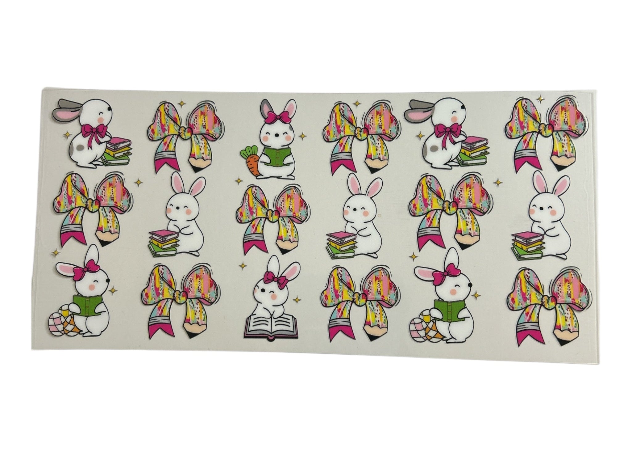 Sheet of stickers with cartoon rabbits and colorful bows on a white background