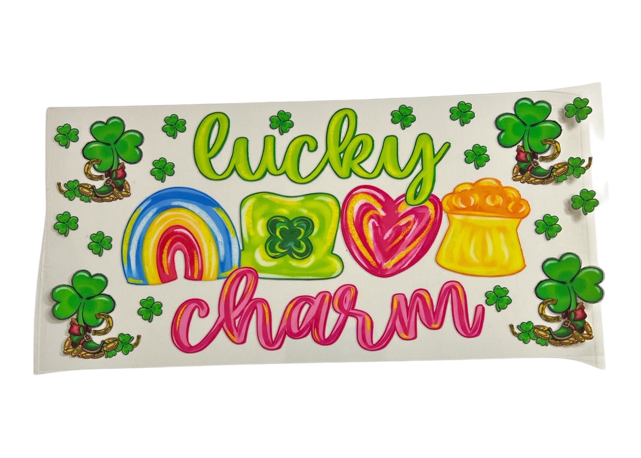 Colorful design with 'lucky charm' text, rainbow, heart, and beer mug on a white background.