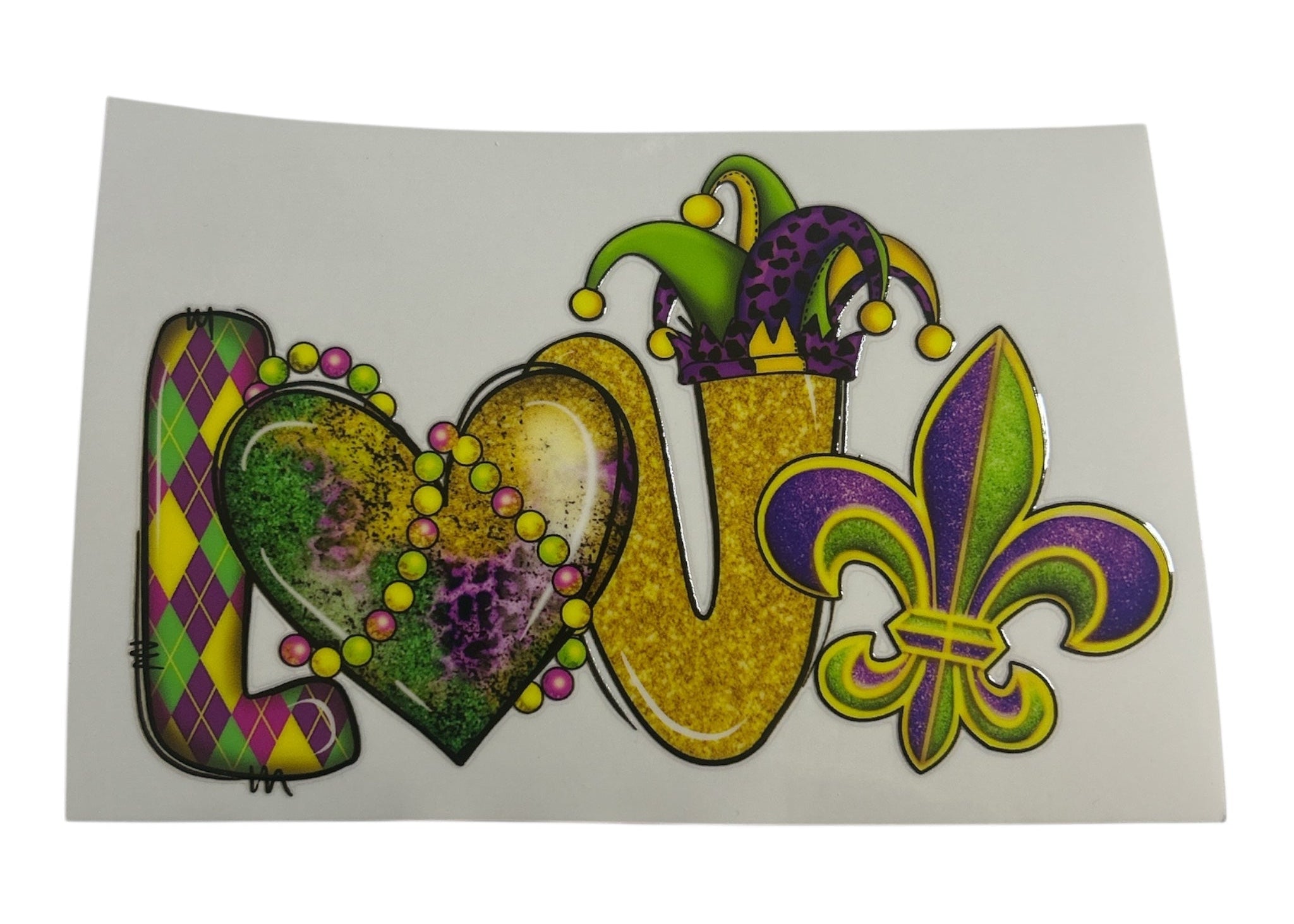 Decorative sticker with 'LOVE' in colorful Mardi Gras-themed letters on a white background