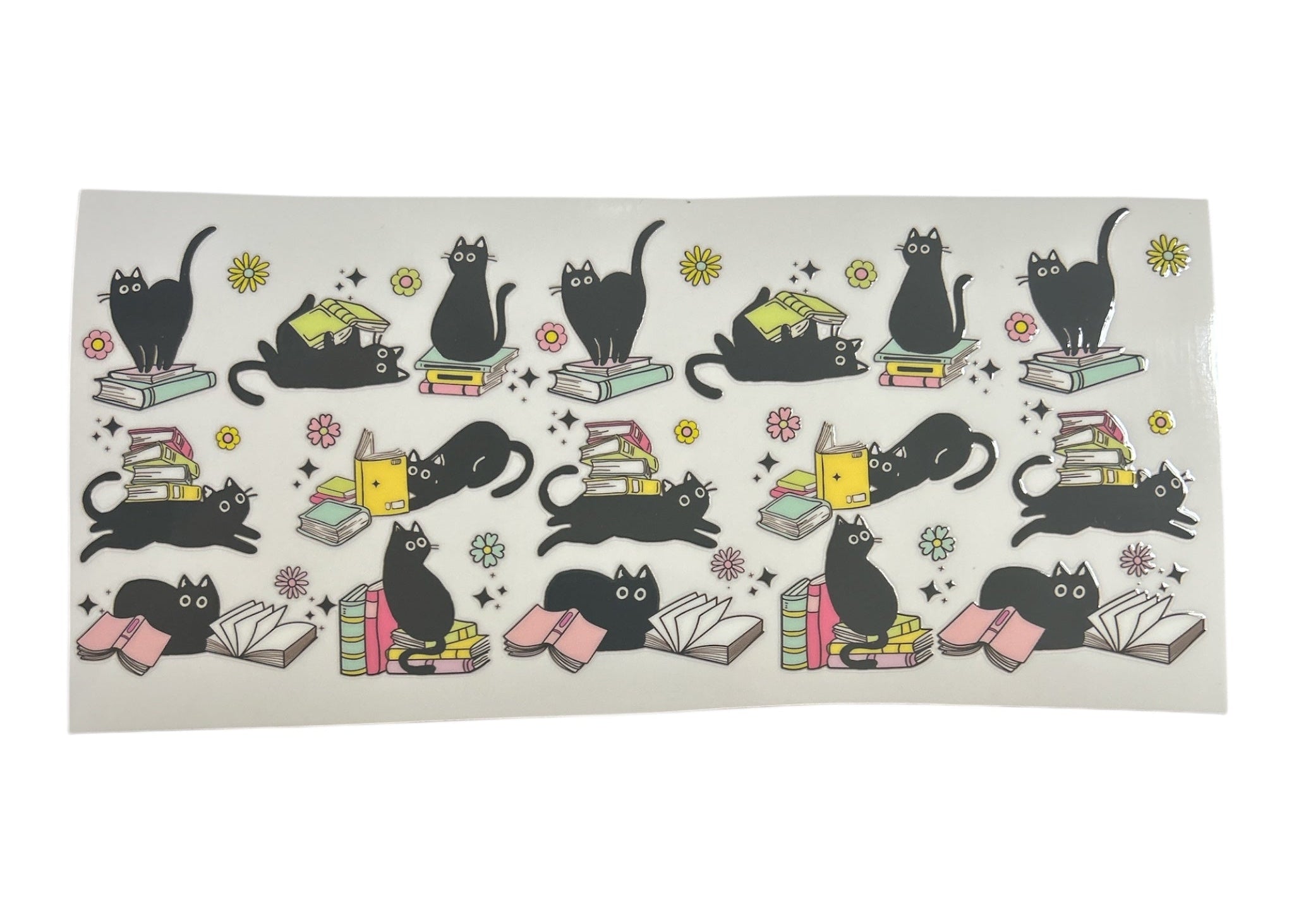 Cup Wrap with black cat illustrations reading books on a white background
