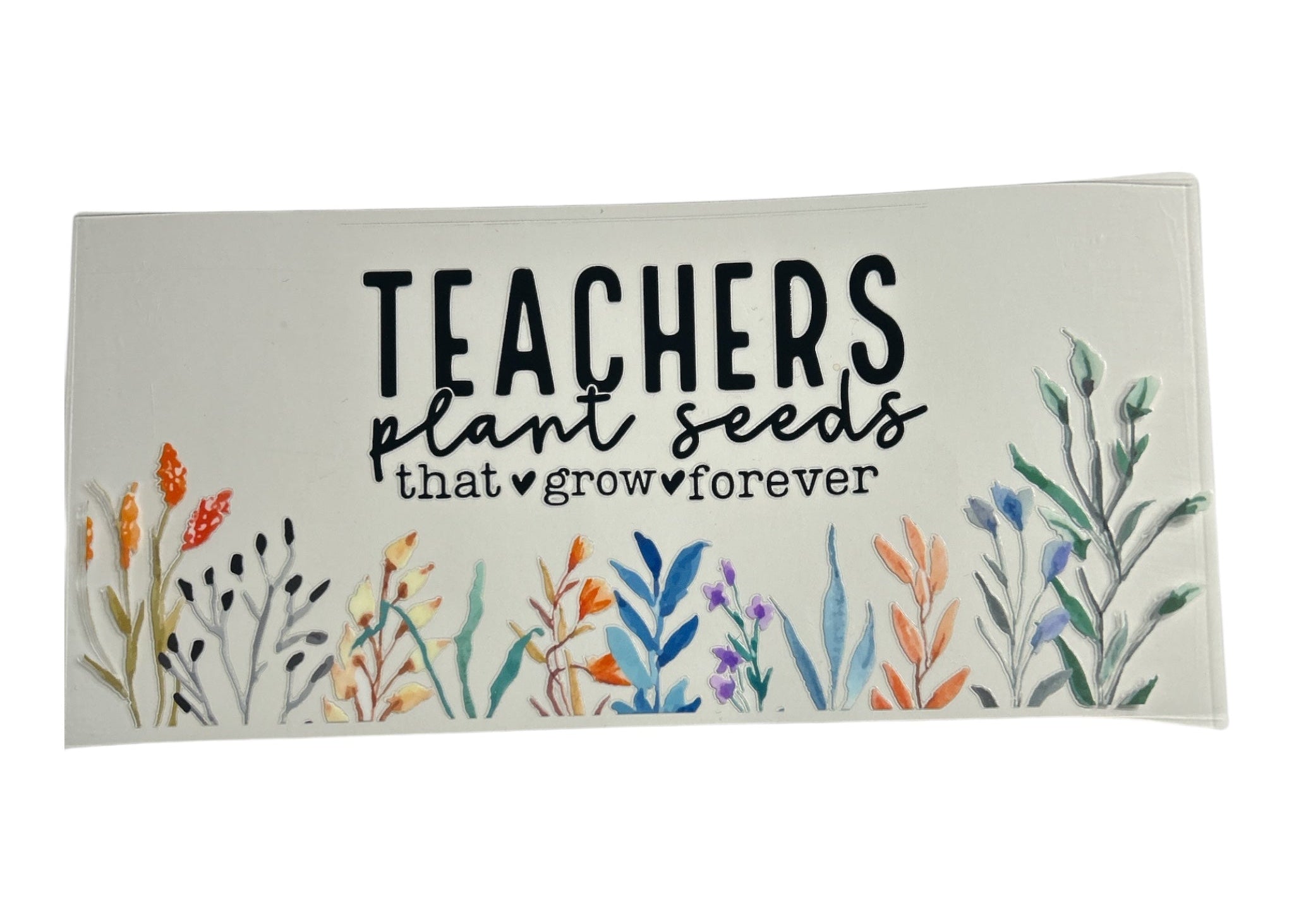 Decorative cup wrap with floral designs and text 'Teachers plant seeds that grow forever' on a white background.