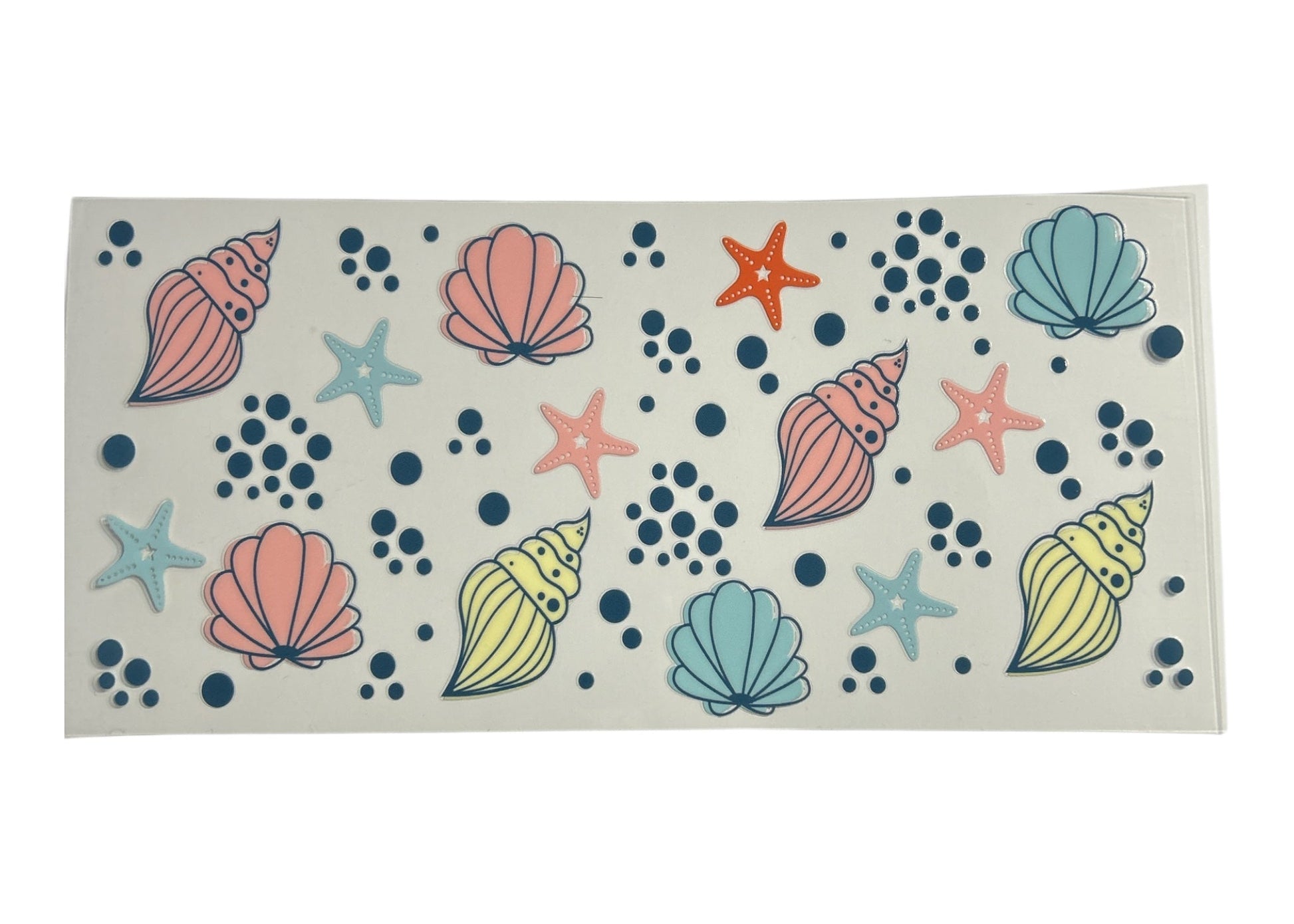 Rectangular cup wrap with shell and starfish pattern on a clear background
