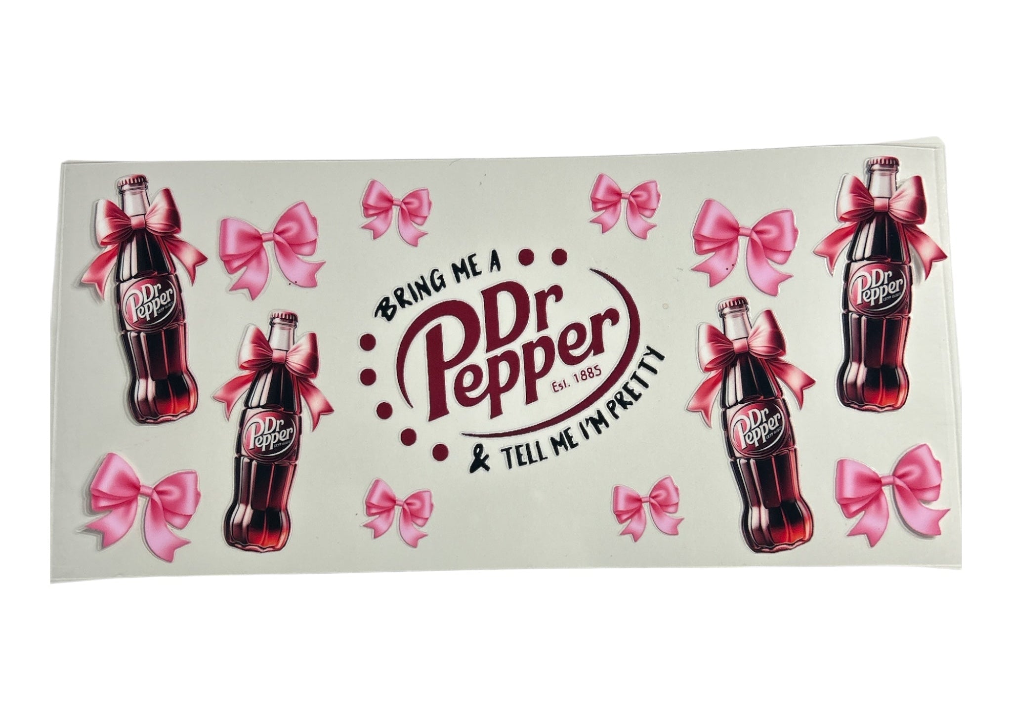 Dr Pepper bottle design with pink bows and text on a clear background