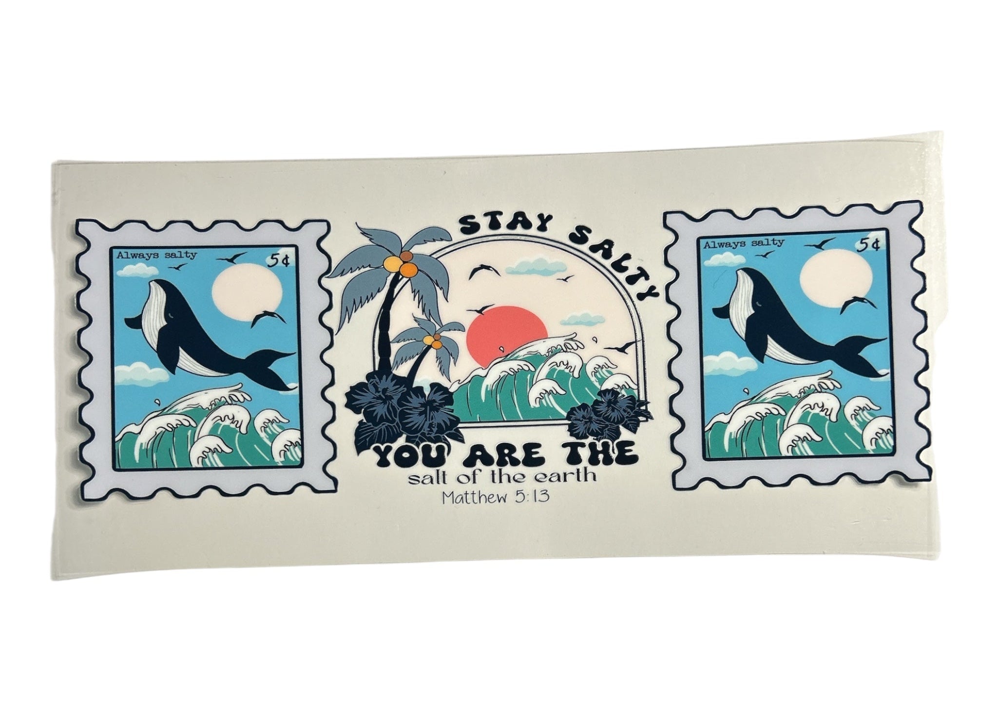 Decorative cup wrap with ocean-themed design featuring whales and palm trees on a clear background and text of a bible verse.