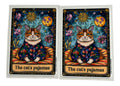 Two tarot card decals featuring a cat in pajamas with a celestial design on a clear background.