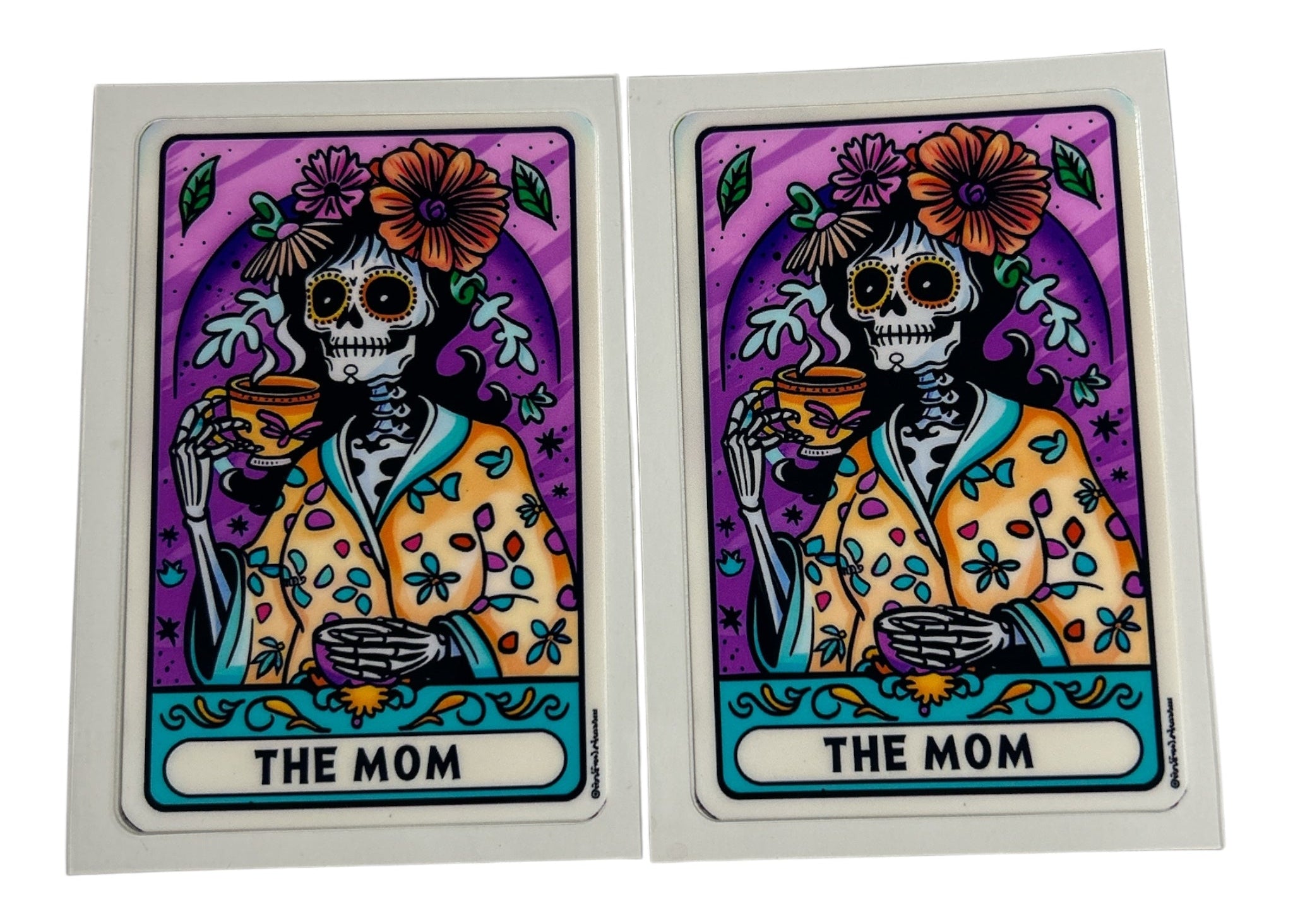 Two identical tarot card decals featuring a skeleton with flowers and the text 'The Mom' on a purple background.