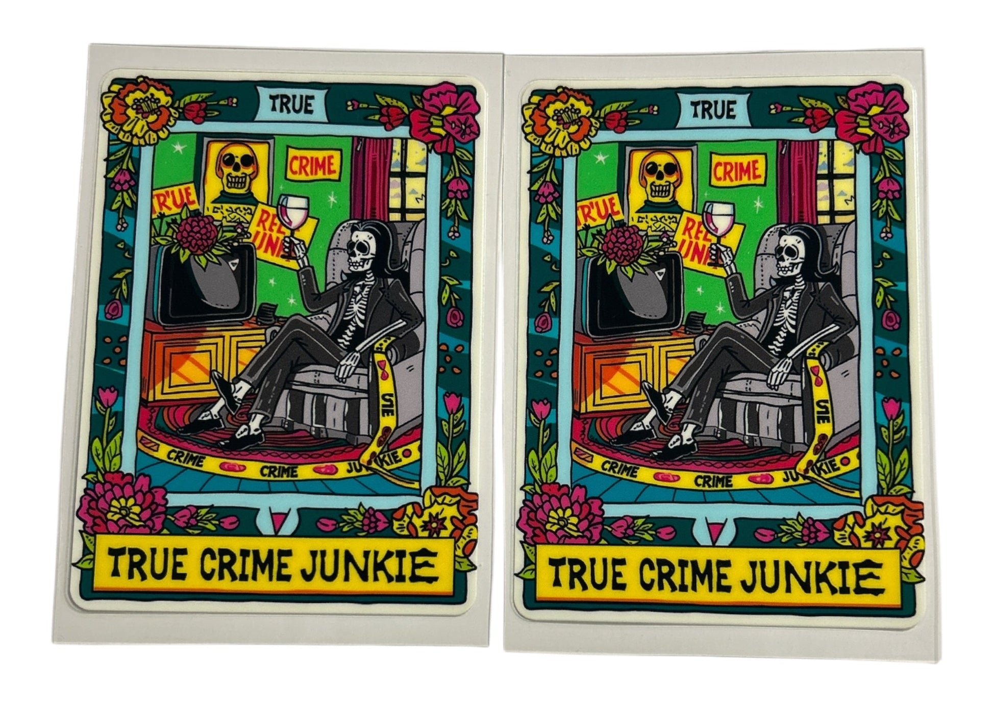 Two identical cards featuring a skeleton, flowers, and text on a white background