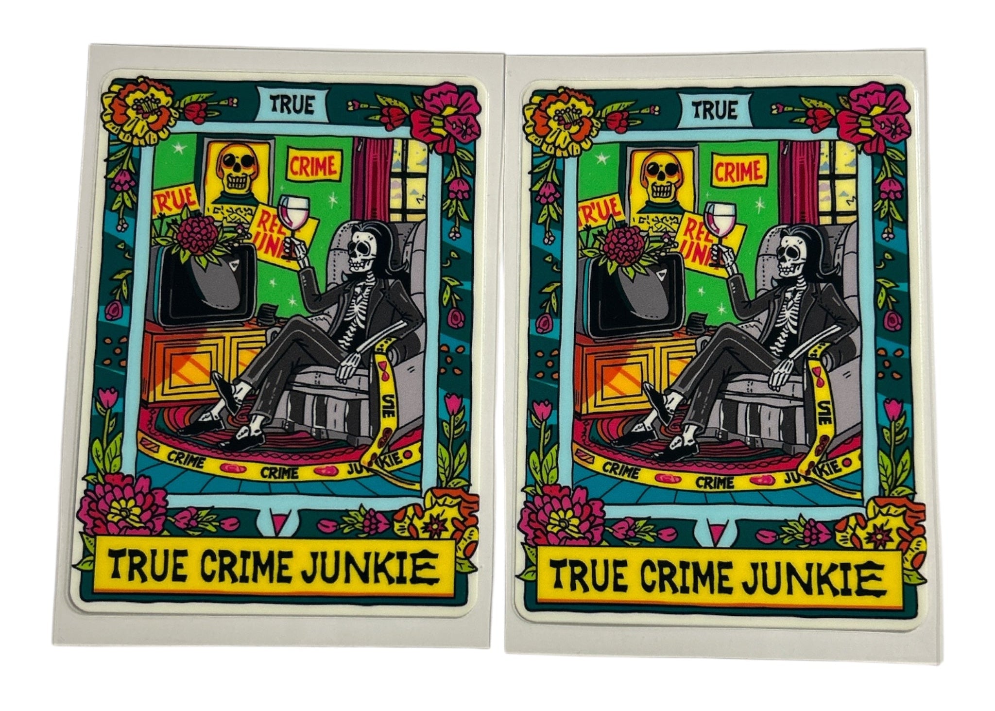 Two identical cards featuring a skeleton, flowers, and text on a white background