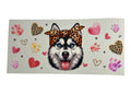 Sticker sheet with a dog wearing a leopard print headband surrounded by hearts and paw prints on a beige background.