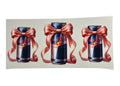 Three Red Bull energy drink cans with pink bows on a white background