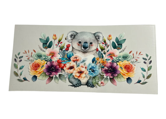 Sticker with a koala surrounded by colorful flowers on a white background