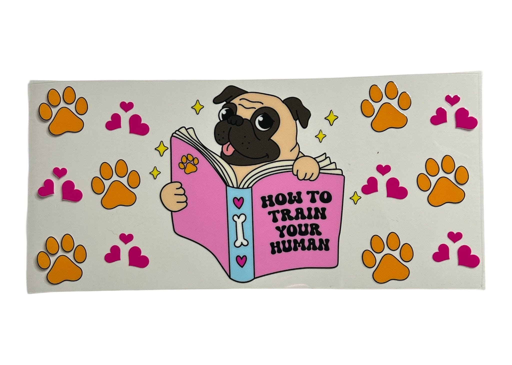 Cartoon pug holding a book titled 'How to Train Your Human' with paw and heart designs on a clear background.