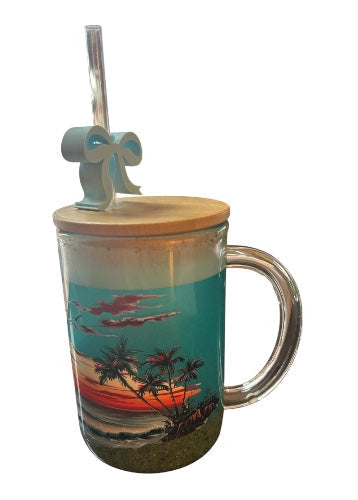 Glass mug with a scenic design, wooden lid, and straw on a white background