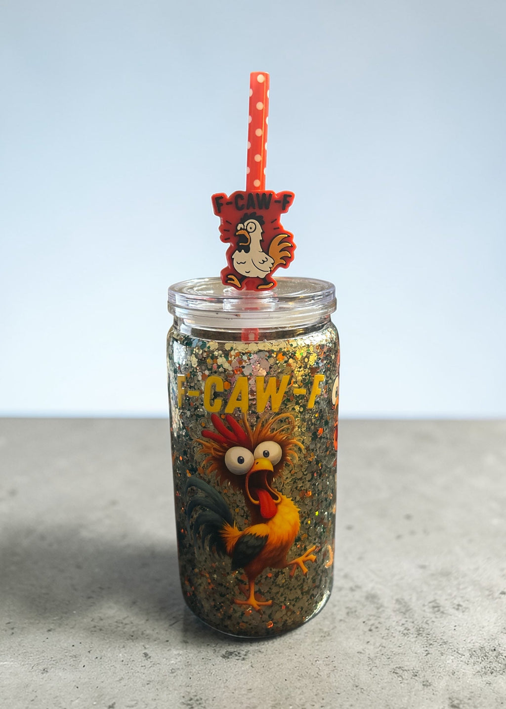 Funny farmhouse chicken glitter tumbler with rooster straw topper on neutral background
