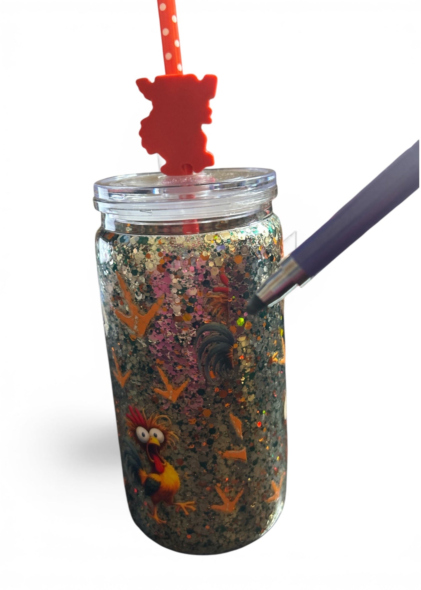 Close-up of partial chicken graphic on back seam of 16oz funny rooster glitter tumbler