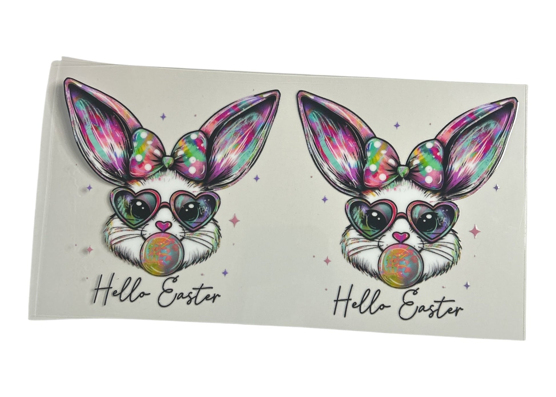 Two colorful Easter bunny designs with rainbow hearts and 'Hello Easter' text on a white background.
