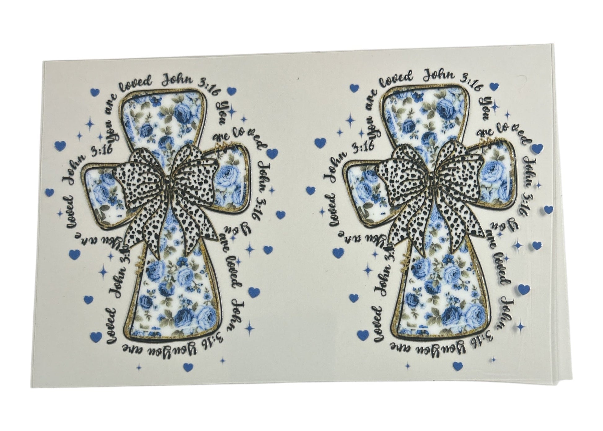 Two decorative crosses with floral patterns and bows on a white background.