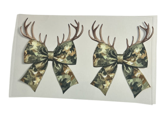 Two camouflage bows with antlers on a white background