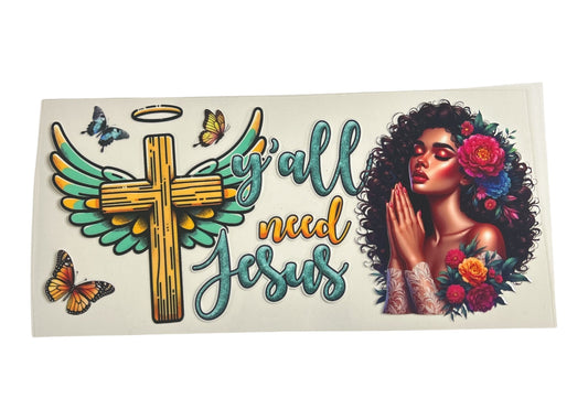 Decorative sticker with cross, wings, flowers, and text on a white background